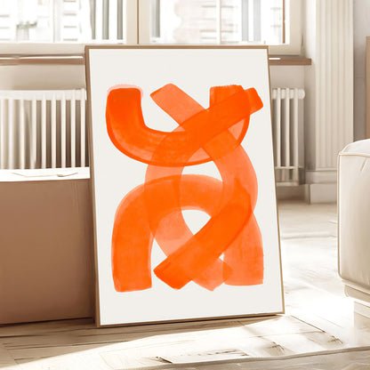 Abstract orange artwork on a white wall in a room with light-colored walls and furniture.