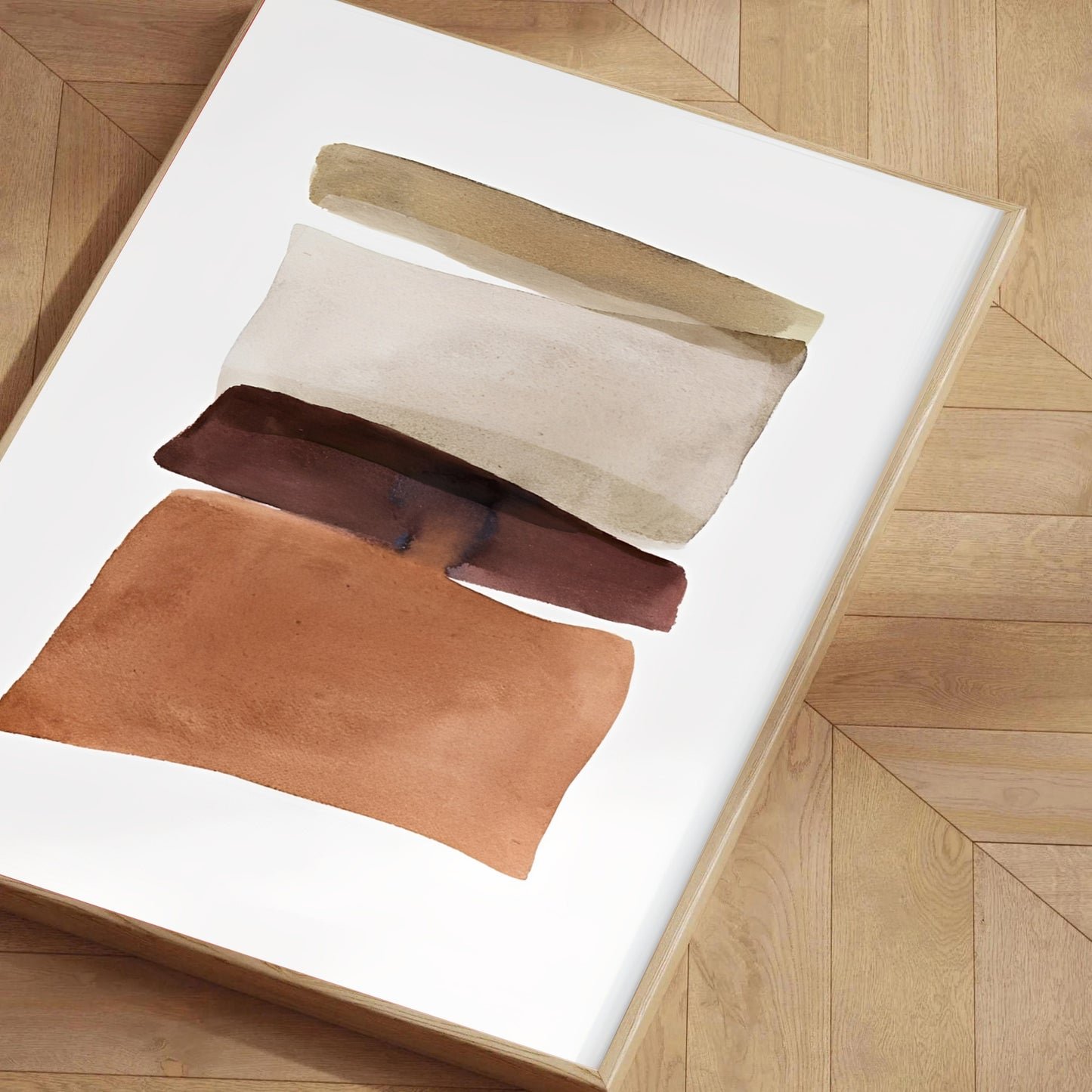 Three leather samples in beige, brown, and rust on a white surface with a wooden floor background.