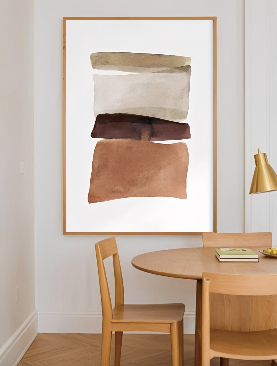 Dining room with abstract art on the wall, wooden table, and chairs.